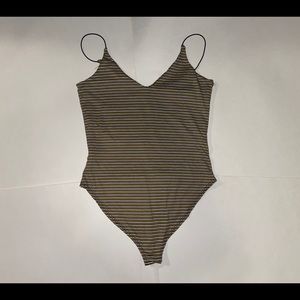 Black yellow and white striped body suit